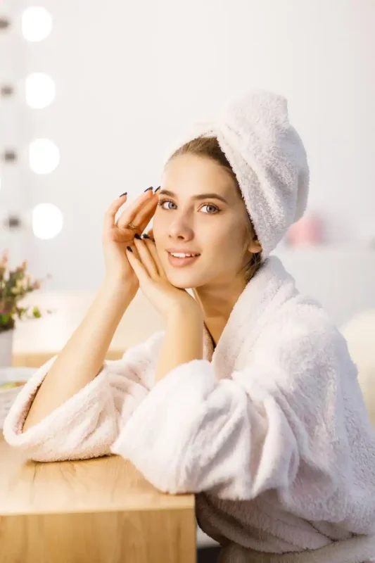 Practitioner performing laser treatment for stretch marks